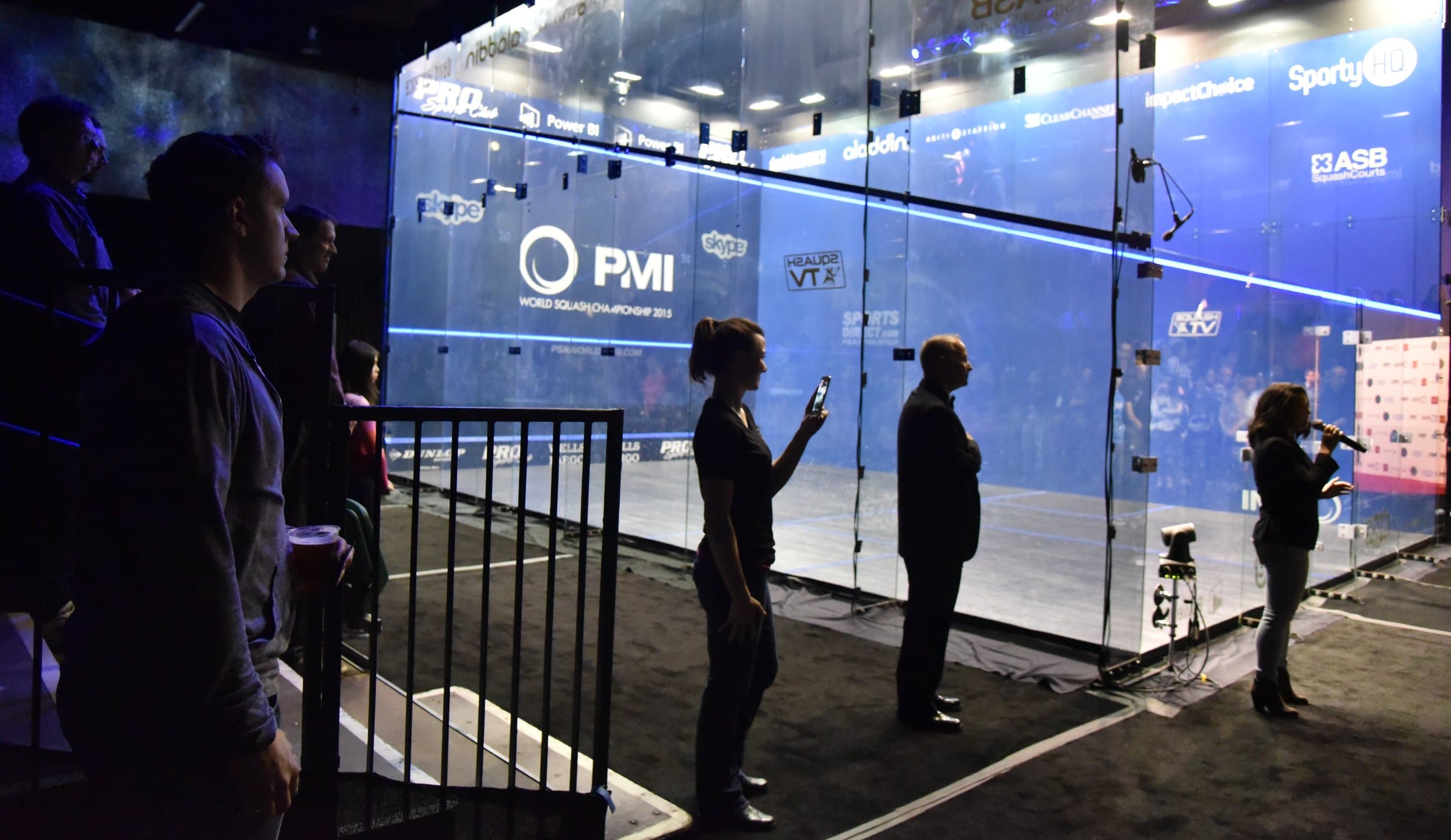 The all-glass show court at the 2015 Men's World Squash Championship in Bellevue, seen from the spectator side