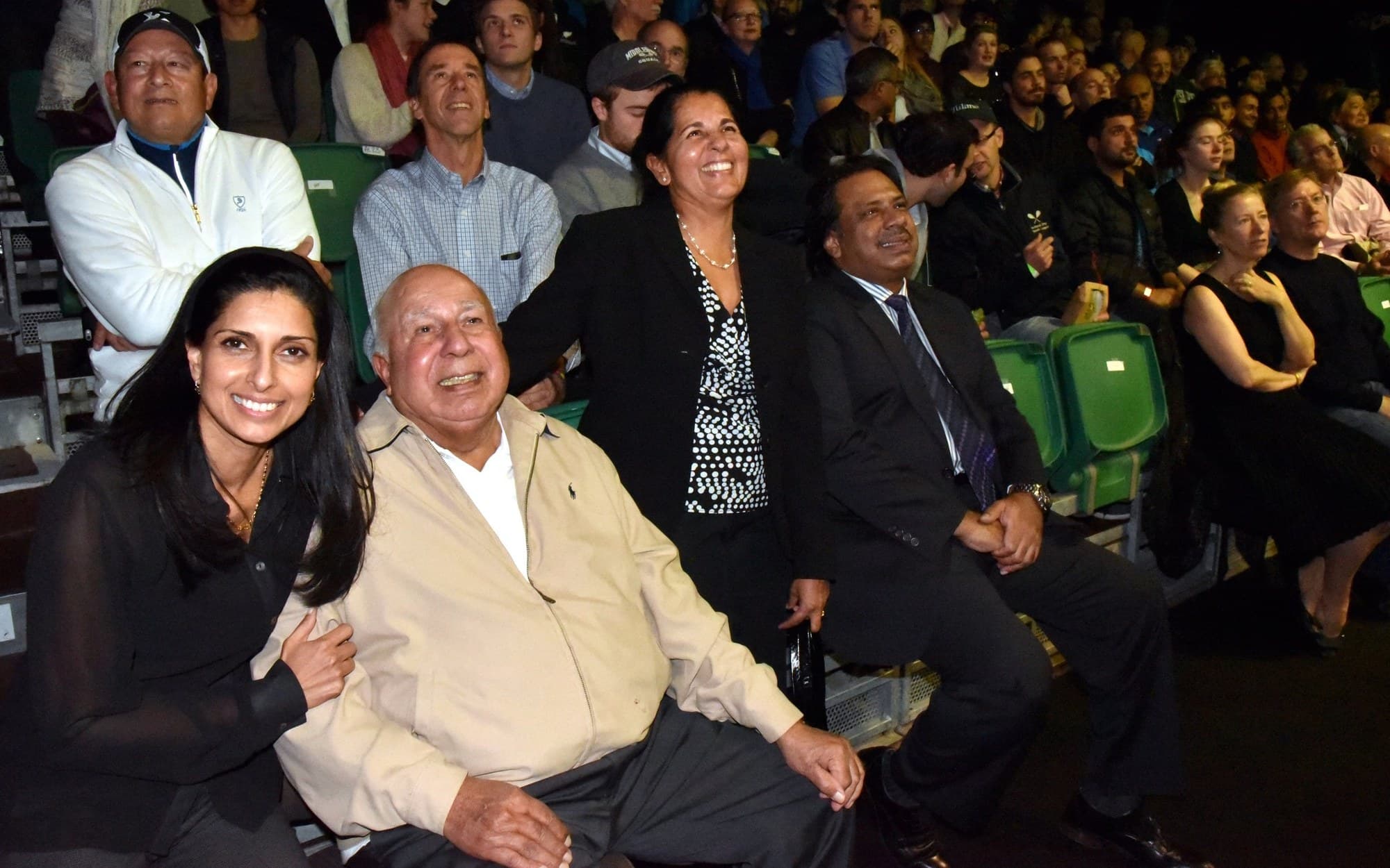 The Khan family in the front row at the 2015 Men's World Squash Championship in Bellevue, Yusuf Khan at the center