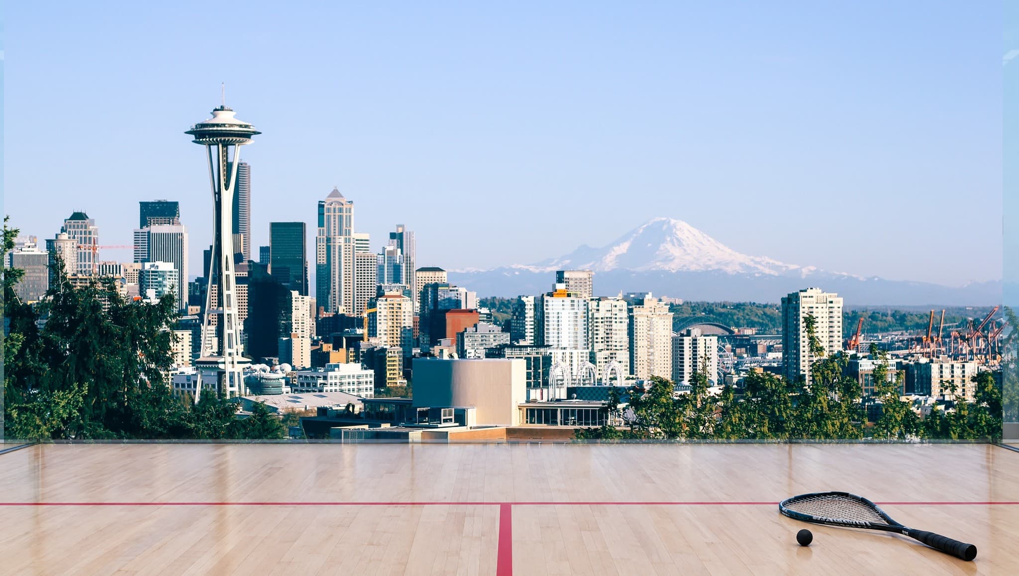 Seattle skyline with the Space Needle and Mount Rainier, seen from a squash court